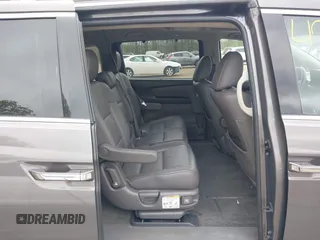 2013 Honda Odyssey Touring with VIN 5FNRL5H94DB013310, listed as a IAAI auction lot 42079565 with 128,622 mi miles and . Bid and sale history available at carsss.com. Image 8.