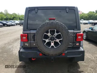2018 Jeep Wrangler Unlimited Rubicon with VIN 1C4HJXFG1JW261472, listed as a Copart auction lot 63259345 with 60,457 mi miles and Salvage title. Bid and sale history available at DreamBid. Image 6.