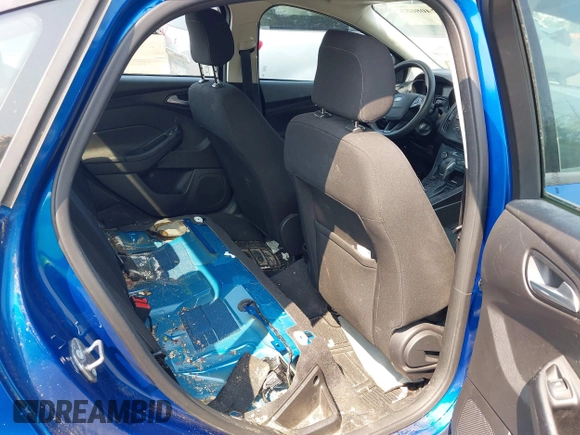 2018 Ford Focus SE z VIN 1FADP3FE1JL254632, wystawiony jako IAAI lot #42408683 z przebiegiem 74 696 mil mil oraz . Historia ofert i sprzedaży dostępna na DreamBid. Obrazek 8.