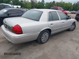 2006 Mercury Grand Marquis GS z VIN 2MEFM74V16X646802, wystawiony jako IAAI lot #42358697 z przebiegiem 169 321 mil mil oraz . Historia ofert i sprzedaży dostępna na DreamBid. Obrazek 4.
