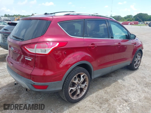 2013 Ford Escape Titanium with VIN 1FMCU0J96DUC67636, listed as a IAAI auction lot 42539425 with 120,593 mi miles and . Bid and sale history available at DreamBid. Image 4.