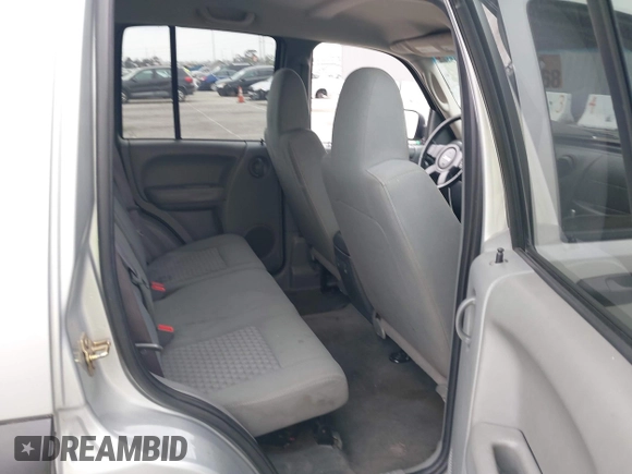 2007 Jeep Liberty Sport with VIN 1J4GK48K67W511199, listed as a IAAI auction lot 42079058 with 156,699 mi miles. Bid and sale history available at carsss.com. Image 8.