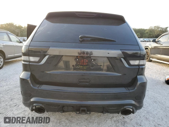 2012 Jeep Grand Cherokee SRT8 with VIN 1C4RJFDJ2CC329621, listed as a Copart auction lot 86772154 with 236,800 mi miles and Salvage Title. Bid and sale history available at carsss.com. Image 6.