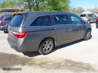 2011 Honda Odyssey EX-L with VIN 5FNRL5H60BB072101, listed as a IAAI auction lot 42002097 with 243,607 mi miles. Bid and sale history available at carsss.com. Image 4.