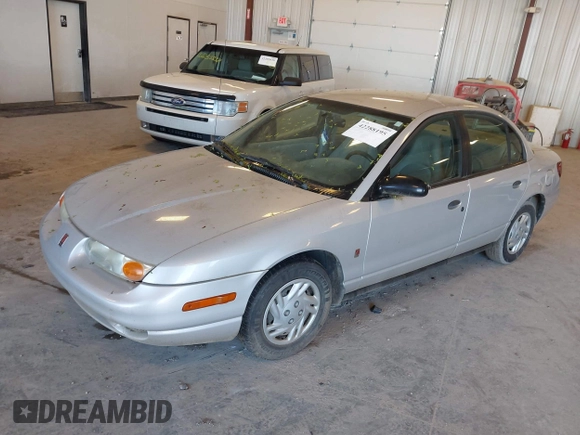 2001 Saturn SL z VIN 1G8ZF52841Z208220, wystawiony jako IAAI lot #42288195 z przebiegiem Nie podano mil oraz . Historia ofert i sprzedaży dostępna na DreamBid. Obrazek 2.