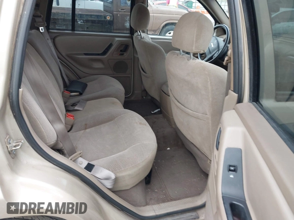 2001 Jeep Grand Cherokee Laredo with VIN 1J4GW48S51C566319, listed as a IAAI auction lot 42184875 with 148,471 mi miles and . Bid and sale history available at DreamBid. Image 8.