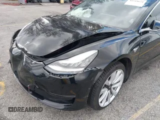 2018 Tesla Model 3 Long Range Battery with VIN 5YJ3E1EA9JF009384, listed as a IAAI auction lot 41544624 with 66,896 mi miles and . Bid and sale history available at DreamBid. Image 6.