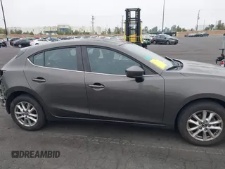2015 Mazda 3 i Touring with VIN JM1BM1L7XF1261134, listed as a IAAI auction lot 42164554 with 130,570 mi miles and . Bid and sale history available at DreamBid. Image 14.