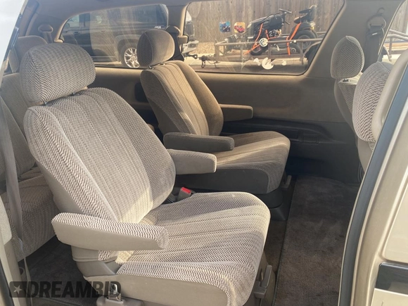 1995 Toyota Previa z VIN JT3AC24S3S1044515, wystawiony jako Copart lot #76413984 z przebiegiem 168 956 mil mil oraz Tytuł czysty. Historia ofert i sprzedaży dostępna na DreamBid. Obrazek 6.
