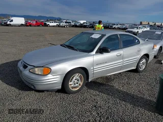 2001 Pontiac Grand Am SE1 with VIN 1G2NF52TX1M560650, listed as a IAAI auction lot 41654339 with 122,885 mi miles. Bid and sale history available at carsss.com. Image 2.