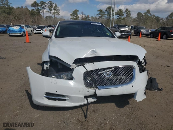 2013 Jaguar XJ with VIN SAJWJ1CD1D8V51865, listed as a Copart auction lot 44382125 with NaN miles and Salvage Title. Bid and sale history available at carsss.com. Image 5.