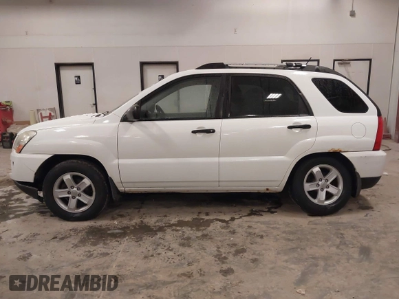 2010 Kia Sportage LX with VIN KNDKGCA35A7718764, listed as a IAAI auction lot 41512368 with 122,420 mi miles and . Bid and sale history available at carsss.com. Image 14.