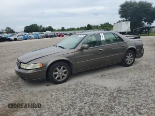 2002 Cadillac Seville Luxury SLS z VIN 1G6KS54Y72U218452, wystawiony jako Copart lot #71632784 z przebiegiem 99 563 mil mil oraz Szkody całkowita. Historia ofert i sprzedaży dostępna na DreamBid. Obrazek 1.