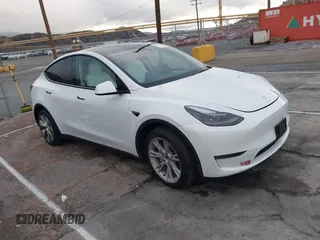 2023 Tesla Model Y Long Range with VIN 7SAYGDEE2PF874729, listed as a IAAI auction lot 41518376 with 10,927 mi miles and . Bid and sale history available at DreamBid. Image 1.