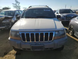 1999 Jeep Grand Cherokee Laredo z VIN 1J4GW58N8XC736438, wystawiony jako Copart lot #88605625 z przebiegiem 181 612 mil mil oraz Czysty tytuł • Clean title. Historia ofert i sprzedaży dostępna na DreamBid. Obrazek 5.
