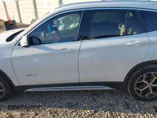 2018 BMW X1 sDrive28i with VIN WBXHU7C36J5H41267, listed as a IAAI auction lot 41270207 with 84,726 mi miles. Bid and sale history available at carsss.com. Image 14.