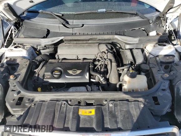 2016 MINI Countryman S with VIN WMWZC5C51GWU01290, listed as a Copart auction lot 77684384 with 106,811 mi miles and Salvage Title. Bid and sale history available at DreamBid. Image 11.