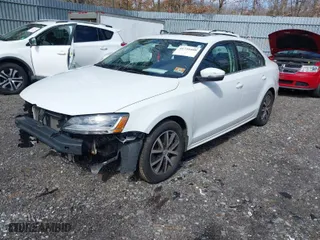 2017 Volkswagen Jetta 1.4T SE with VIN 3VWDB7AJXHM415912, listed as a IAAI auction lot 41735408 with 123,540 mi miles. Bid and sale history available at carsss.com. Image 2.