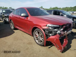 2021 BMW X4 M40i with VIN 5UX2V5C0XM9E78318, listed as a Copart auction lot 57834645 with 67,277 mi miles and Salvage title. Bid and sale history available at DreamBid. Image 4.