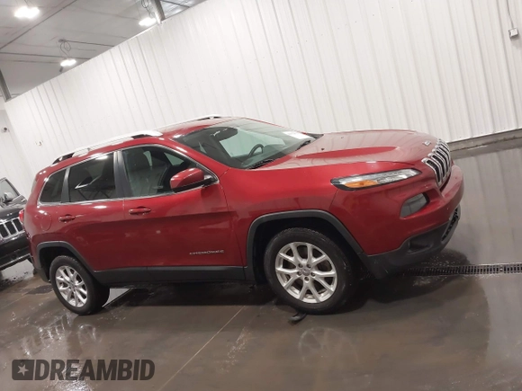 2015 Jeep Cherokee Latitude with VIN 1C4PJLCB6FW616477, listed as a IAAI auction lot 41812431 with 131,234 mi miles. Bid and sale history available at carsss.com. Image 14.