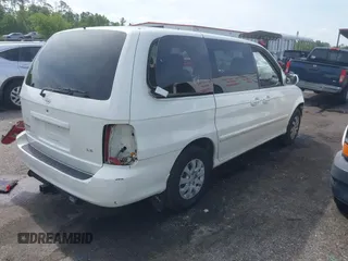2005 Kia Sedona LX with VIN KNDUP132056702484, listed as a IAAI auction lot 42099572 with 195,528 mi miles and . Bid and sale history available at DreamBid. Image 4.
