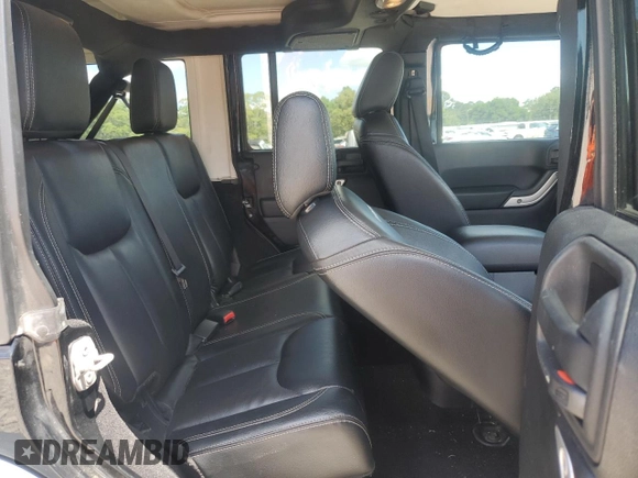 2015 Jeep Wrangler Unlimited Rubicon z VIN 1C4BJWFG2FL530863, wystawiony jako Copart lot #56345965 z przebiegiem 149 754 mil mil oraz Szkoda całkowita • Salvage title. Historia ofert i sprzedaży dostępna na DreamBid. Obrazek 11.