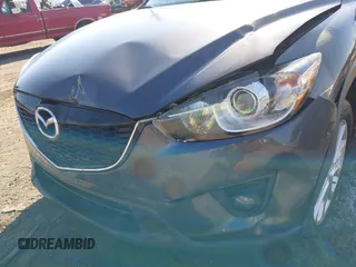 2014 Mazda CX-5 Grand Touring with VIN JM3KE4DY2E0312952, listed as a IAAI auction lot 42138721 with 99,993 mi miles and . Bid and sale history available at DreamBid. Image 6.