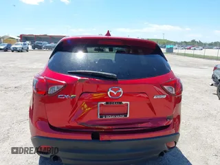 2016 Mazda CX-5 Touring with VIN JM3KE2CY6G0830409, listed as a IAAI auction lot 42049299 with 39,317 mi miles. Bid and sale history available at carsss.com. Image 6.