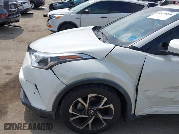 2019 Toyota C-HR XLE with VIN JTNKHMBX9K1054053, listed as a IAAI auction lot 42120256 with 67,083 mi miles and . Bid and sale history available at DreamBid. Image 19.