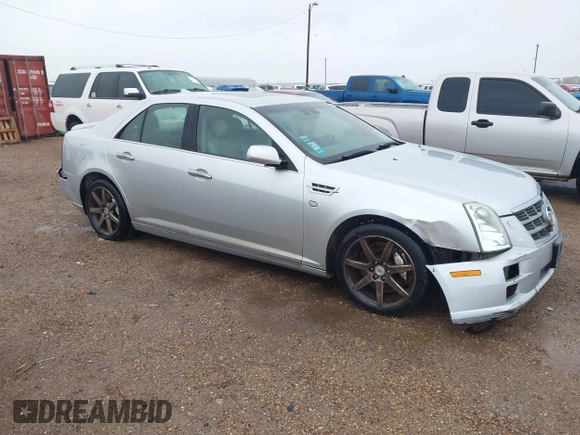 2010 Cadillac STS AWD z VIN 1G6DU6EV4A0114410, wystawiony jako IAAI lot #41301240 z przebiegiem 120 023 mil mil oraz . Historia ofert i sprzedaży dostępna na DreamBid. Obrazek 1.