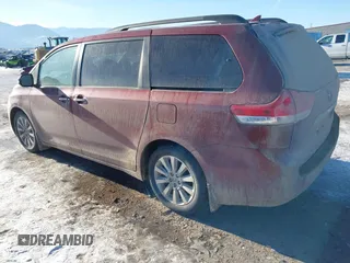 2014 Toyota Sienna XLE with VIN 5TDYK3DC5ES425818, listed as a IAAI auction lot 41421282 with 105,586 mi miles and . Bid and sale history available at DreamBid. Image 3.