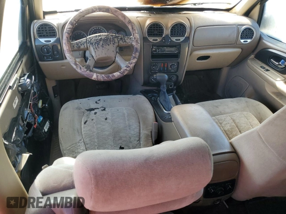 2004 GMC Envoy SLT z VIN 1GKET16S546133758, wystawiony jako Copart lot #76717674 z przebiegiem Nie podano mil oraz Szkoda całkowita • Salvage title. Historia ofert i sprzedaży dostępna na DreamBid. Obrazek 8.