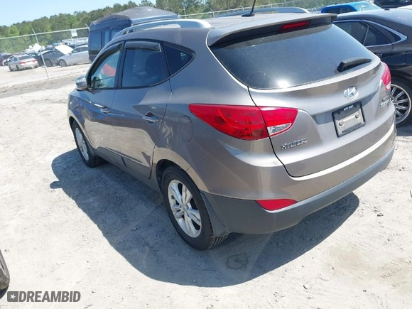 2013 Hyundai Tucson GLS with VIN KM8JU3AC0DU557505, listed as a IAAI auction lot 42017594 with 159,551 mi miles. Bid and sale history available at carsss.com. Image 3.