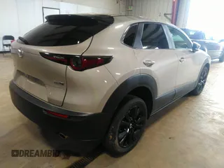 2024 Mazda CX-30 2.5 S Select Sport with VIN 3MVDMBBM0RM658069, listed as a IAAI auction lot 42130803 with 26,714 mi miles. Bid and sale history available at carsss.com. Image 4.