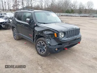 2017 Jeep Renegade Trailhawk z VIN ZACCJBCB9HPG55038, wystawiony jako IAAI lot #41737043 z przebiegiem 103 488 mil mil oraz . Historia ofert i sprzedaży dostępna na DreamBid. Obrazek 1.