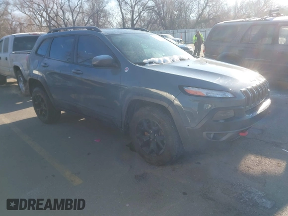 2015 Jeep Cherokee Trailhawk with VIN 1C4PJMBS3FW510219, listed as a IAAI auction lot 41440297 with 144,012 mi miles and . Bid and sale history available at DreamBid. Image 1.