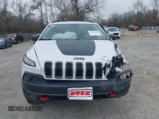 2015 Jeep Cherokee Trailhawk with VIN 1C4PJMBB7FW741365, listed as a IAAI auction lot 41879685 with 94,135 mi miles and . Bid and sale history available at carsss.com. Image 13.