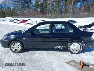 2006 Mitsubishi Lancer ES with VIN JA3AJ26E06U000385, listed as a IAAI auction lot 41587490 with 185,100 mi miles. Bid and sale history available at carsss.com. Image 14.