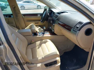 2004 Volkswagen Touareg with VIN WVGCM67L44D033856, listed as a IAAI auction lot 42142143 with 105,682 mi miles and . Bid and sale history available at DreamBid. Image 5.
