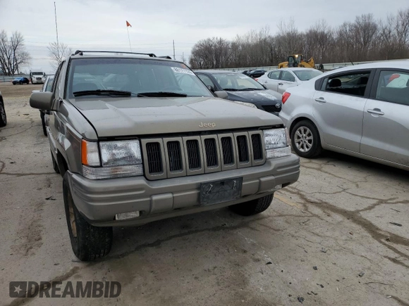 1997 Jeep Grand Cherokee Limited with VIN 1J4GZ78Y3VC568413, listed as a Copart auction lot 86171124 with 104,558 mi miles and Salvage Title. Bid and sale history available at carsss.com. Image 5.