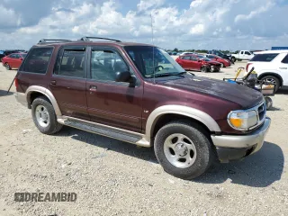 2000 Ford Explorer Eddie Bauer with VIN 1FMZU84PXYZB45910, listed as a Copart auction lot 71650514 with 234,398 mi miles and Salvage title. Bid and sale history available at DreamBid. Image 4.