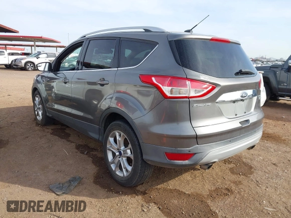 2014 Ford Escape Titanium with VIN 1FMCU0JX5EUC00297, listed as a IAAI auction lot 41928316 with 146,406 mi miles. Bid and sale history available at carsss.com. Image 3.