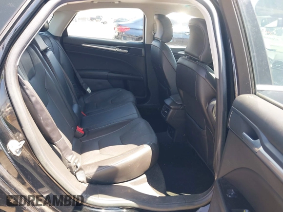 2016 Ford Fusion Titanium Hybrid z VIN 3FA6P0RUXGR123445, wystawiony jako IAAI lot #42606596 z przebiegiem 145 541 mil mil oraz . Historia ofert i sprzedaży dostępna na DreamBid. Obrazek 8.