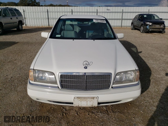 1995 Mercedes-Benz C with VIN WDBHA28E1SF151911, listed as a Copart auction lot 76814424 with 128,184 mi miles and Clean Title. Bid and sale history available at carsss.com. Image 5.