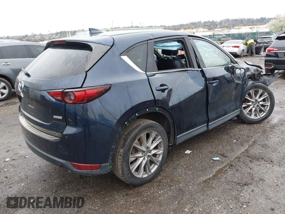 2019 Mazda CX-5 Grand Touring with VIN JM3KFBDM6K0592496, listed as a IAAI auction lot 41730103 with Not Provided miles and . Bid and sale history available at carsss.com. Image 4.
