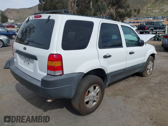 2004 Ford Escape XLT with VIN 1FMYU03134KA80217, listed as a IAAI auction lot 41672764 with 184,601 mi miles. Bid and sale history available at carsss.com. Image 4.