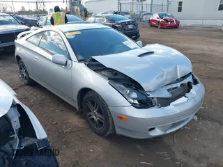 2002 Toyota Celica GT with VIN JTDDR32T120140349, listed as a IAAI auction lot 42037609 with 165,177 mi miles. Bid and sale history available at carsss.com. Image 1.