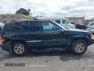 1996 Jeep Grand Cherokee Limited z VIN 1J4GZ78Y3TC191000, wystawiony jako IAAI lot #42259621 z przebiegiem 212 690 mil mil oraz . Historia ofert i sprzedaży dostępna na DreamBid. Obrazek 13.