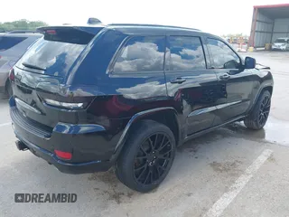 2021 Jeep Grand Cherokee Laredo X with VIN 1C4RJFAG2MC516111, listed as a IAAI auction lot 42222439 with 60,888 mi miles and . Bid and sale history available at DreamBid. Image 4.