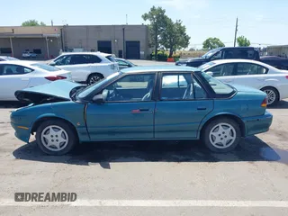 1995 Saturn SL with VIN 1G8ZK5275SZ303745, listed as a IAAI auction lot 42280801 with 137,719 mi miles and . Bid and sale history available at DreamBid. Image 14.